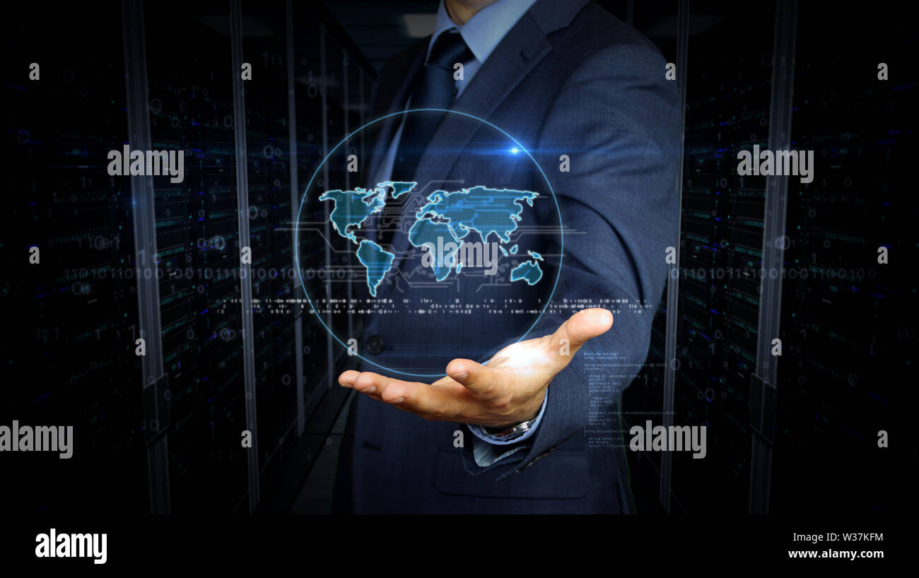 A businessman in a suit and screen with world symbol hologram. Man using virtual display interface. Global business, worldwide network, globalization, Stock Photo