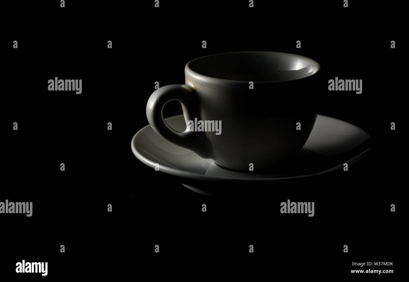Isolated cup of coffee on black background Stock Photo