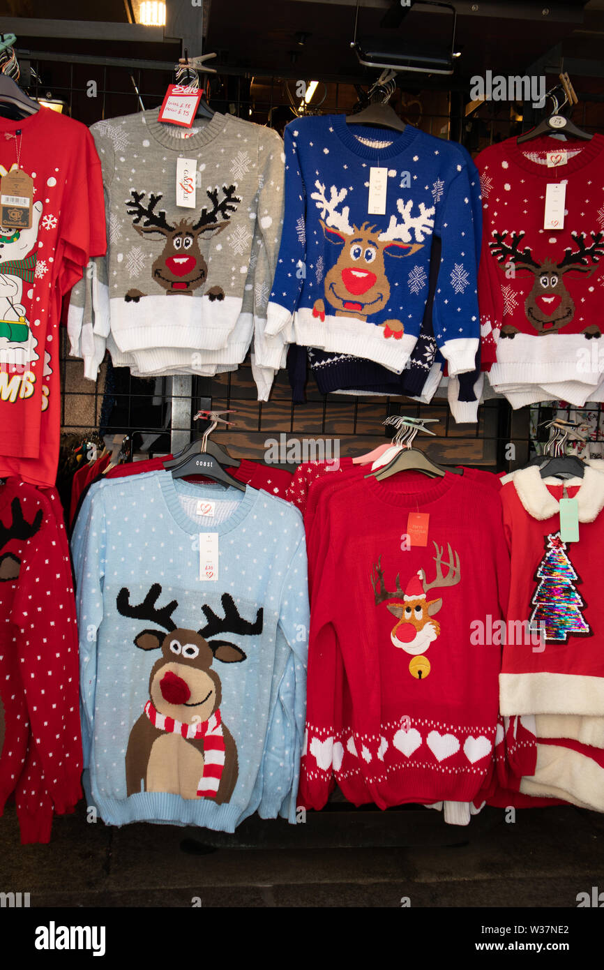 Novelty Christmas jumpers and sweaters are colloquially ugly and have funny bold Christmas designs.for sale Stock Photo