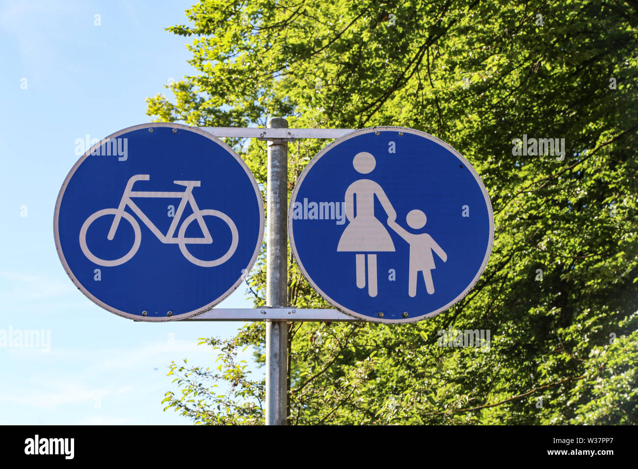 A road sign points to a footpath and a bike path Stock Photo Alamy