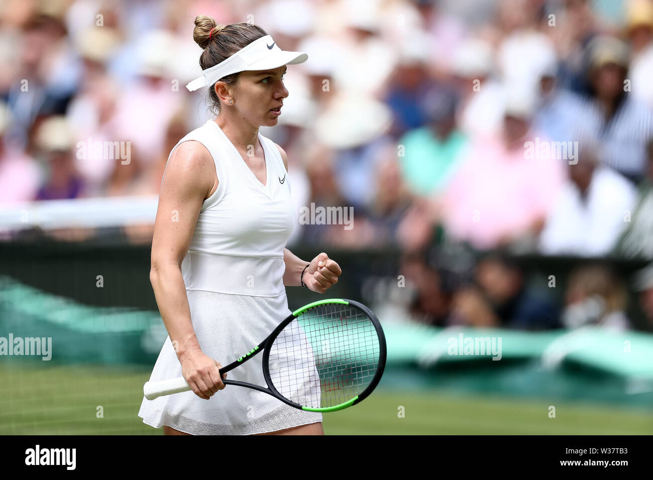London, UK. 13th July, 2019.London, UK. 13th July, 2019.London, UK.  The All England Lawn Tennis and Croquet Club, Wimbledon, England, Wimbledon Tennis Tournament, Day 12; Simona Halep (ROM) celebrates winning a point against Serena Williams (USA) Credit: Action Plus Sports Images/Alamy Live News Credit: Action Plus Sports Images/Alamy Live News Stock Photo