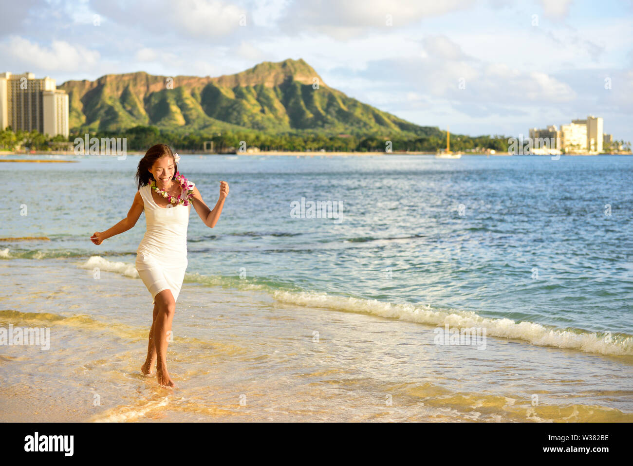 Hawaii woman having fun on Waikiki beach, Honolulu. Asian adult ...