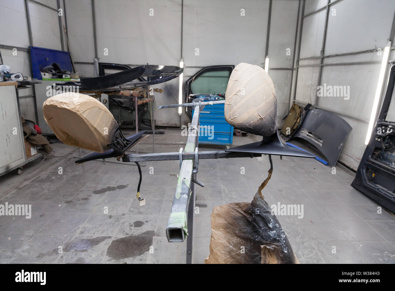 Painting and drying in professional box of car body parts after