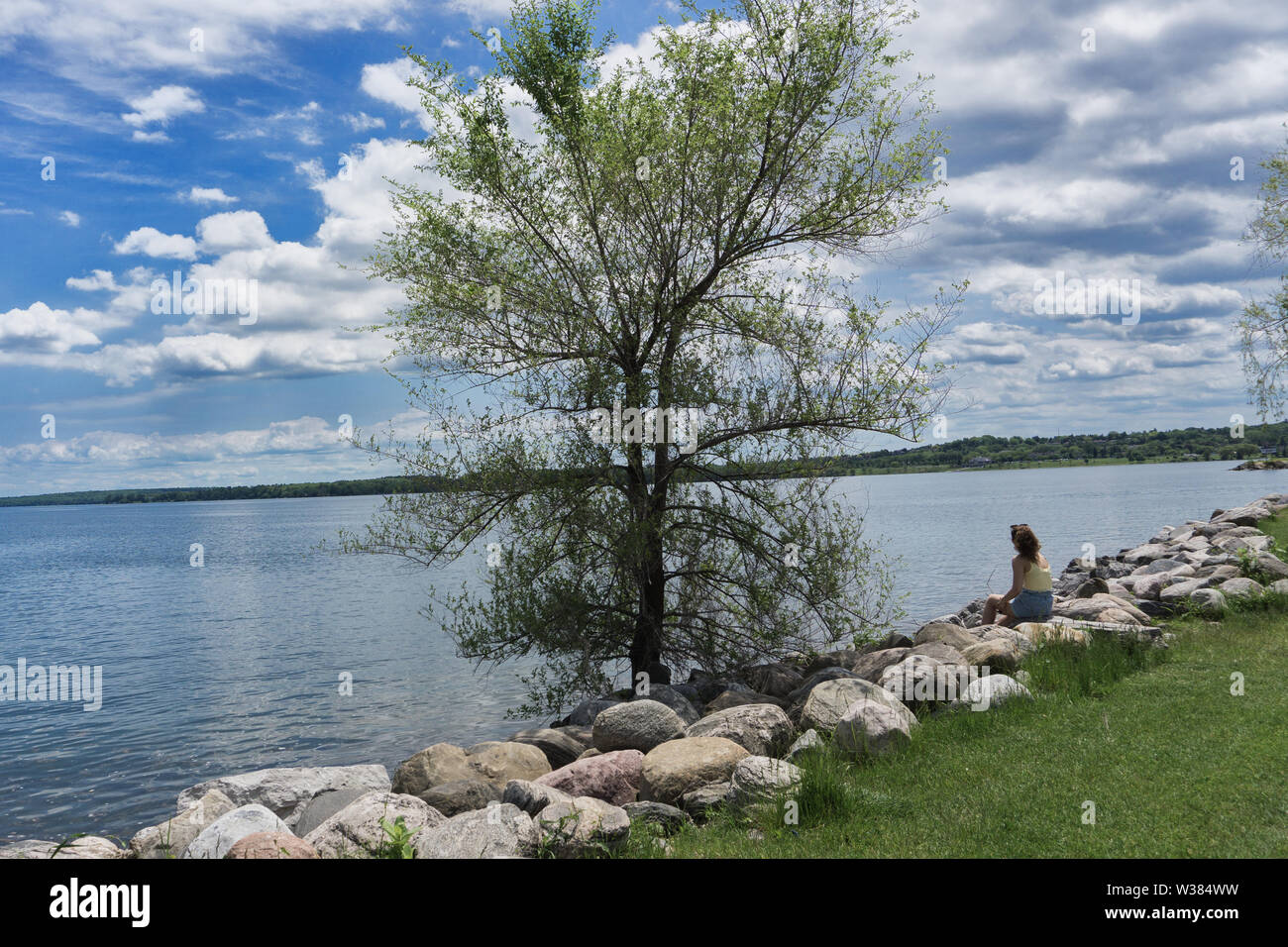 Canada Ontario Barrie at June 2019, Lunch break in the park, a woman is relaxing Stock Photo