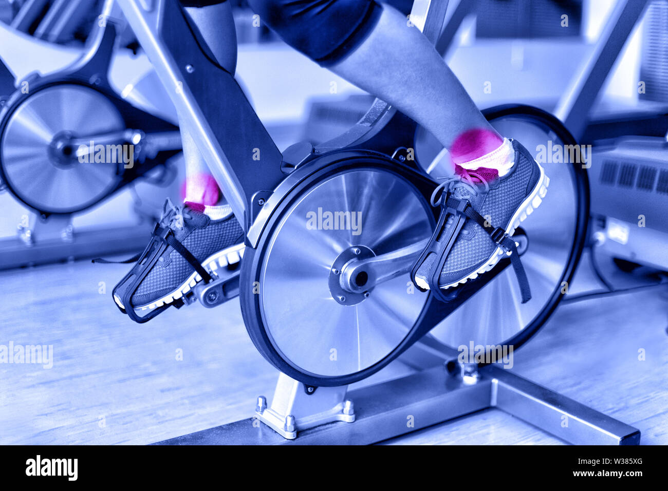 Sports injury ankle pain during training on spinning bike at gym