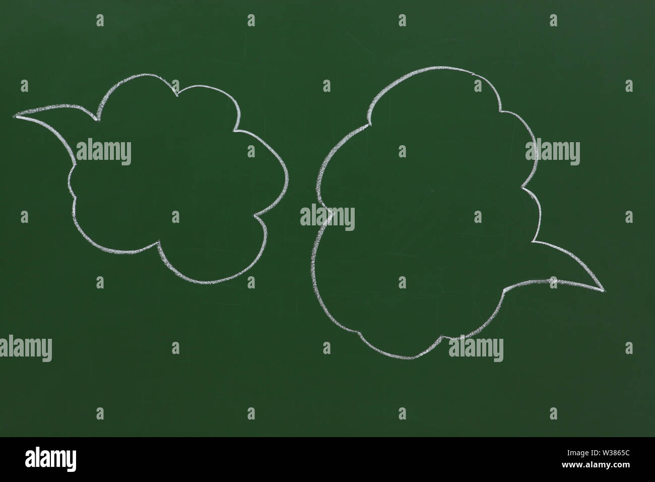 Speech bubbles on a blackboard Stock Photo