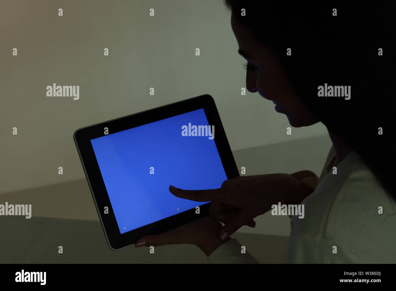 Woman using a digital tablet Stock Photo