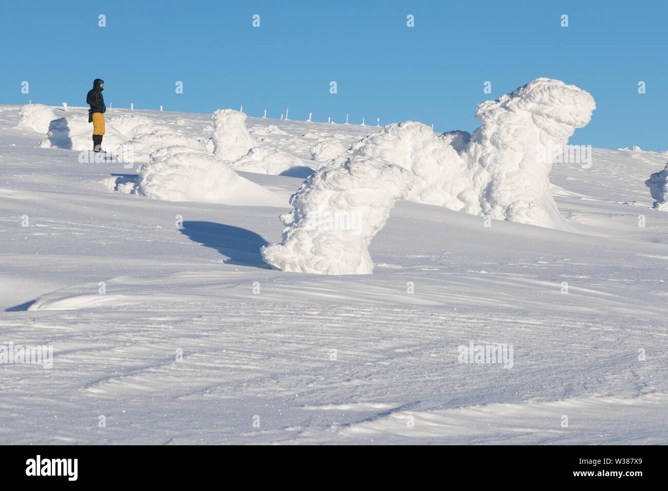 Snow Structure with sunshine in the Background, Panorama of Snow Holes With Wawel Transmitter - Krkonose (Giant Mountains), Czech Republic, Europe Sun Stock Photo