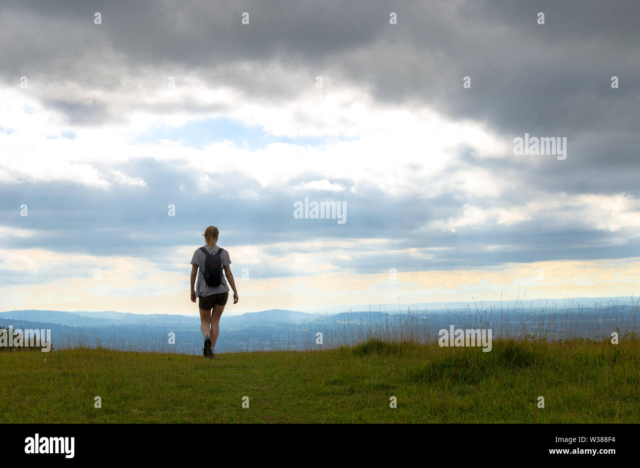Woman hiking on the Cotswold Way in Gloucestershire, England Stock Photo