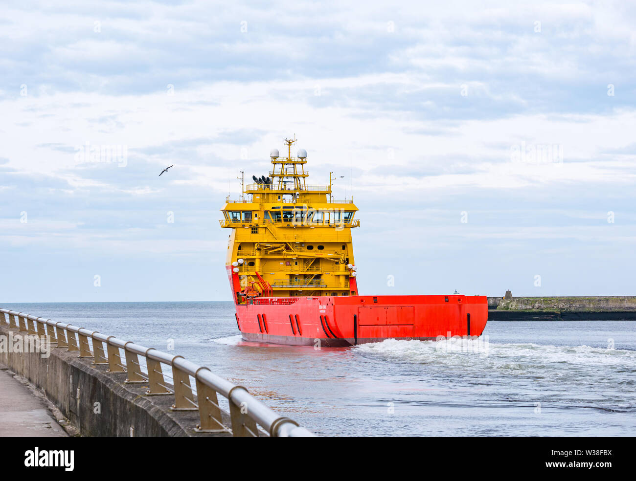 Ostensjo Rederi fleet ship, Edda Ferd, offshore supply vessel, leaving Aberdeen harbour, Scotland, UK Stock Photo