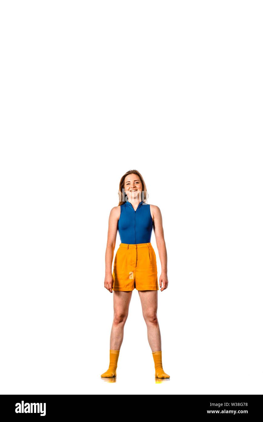 Stylish ballet dancer standing, isolated on white background Stock Photo