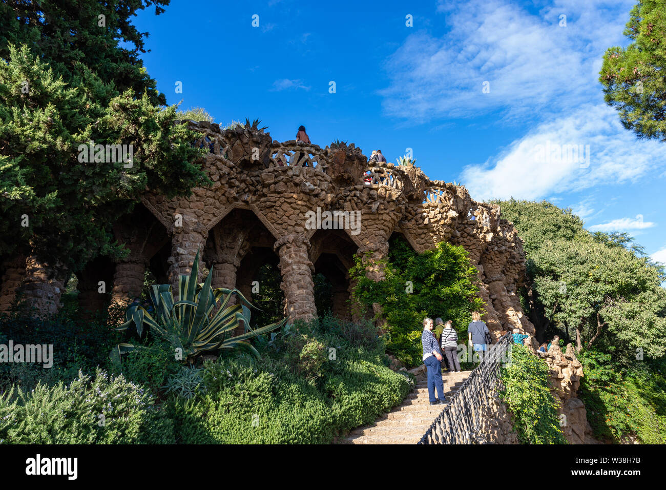 Guell, detail of Portico della Lavandaia, surrounded by wild Barcelona, Spain Stock Photo -