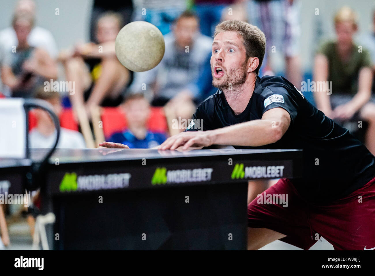 Kaiserslautern, Germany. 13th July, 2019. Cornelius Döll plays against a  team-mate in the finals of the World Championship in the trend sport Headis.  The headball table tennis was developed in 2006 in
