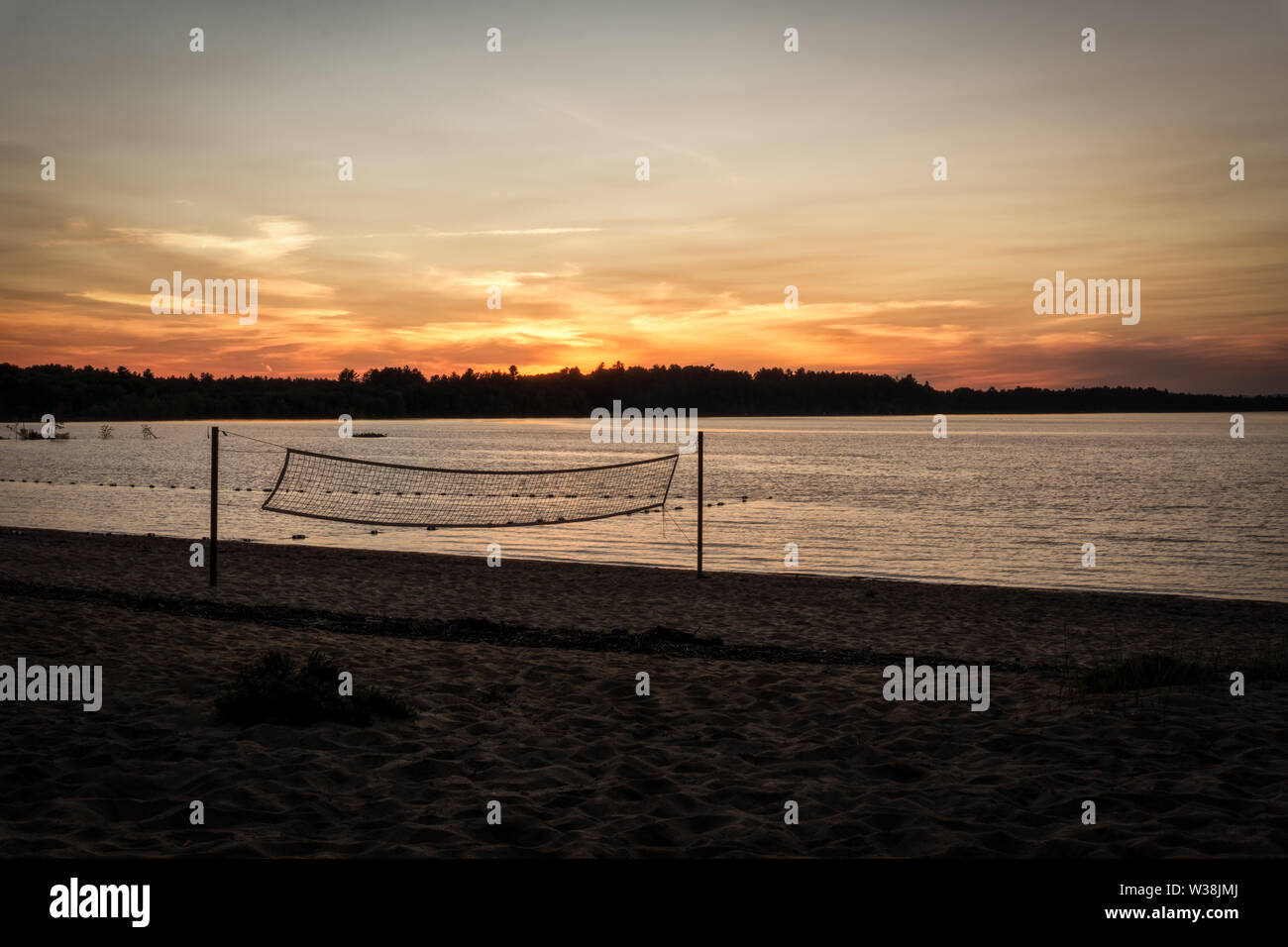 A beautiful sunset at Black Bear Beach, Canada, Petawawa, in the foreground a volleyball net, Stock Photo