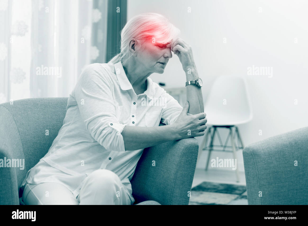 Red Point Effect Older woman has a headache. Pain, red point effect. Senior healthcare ...