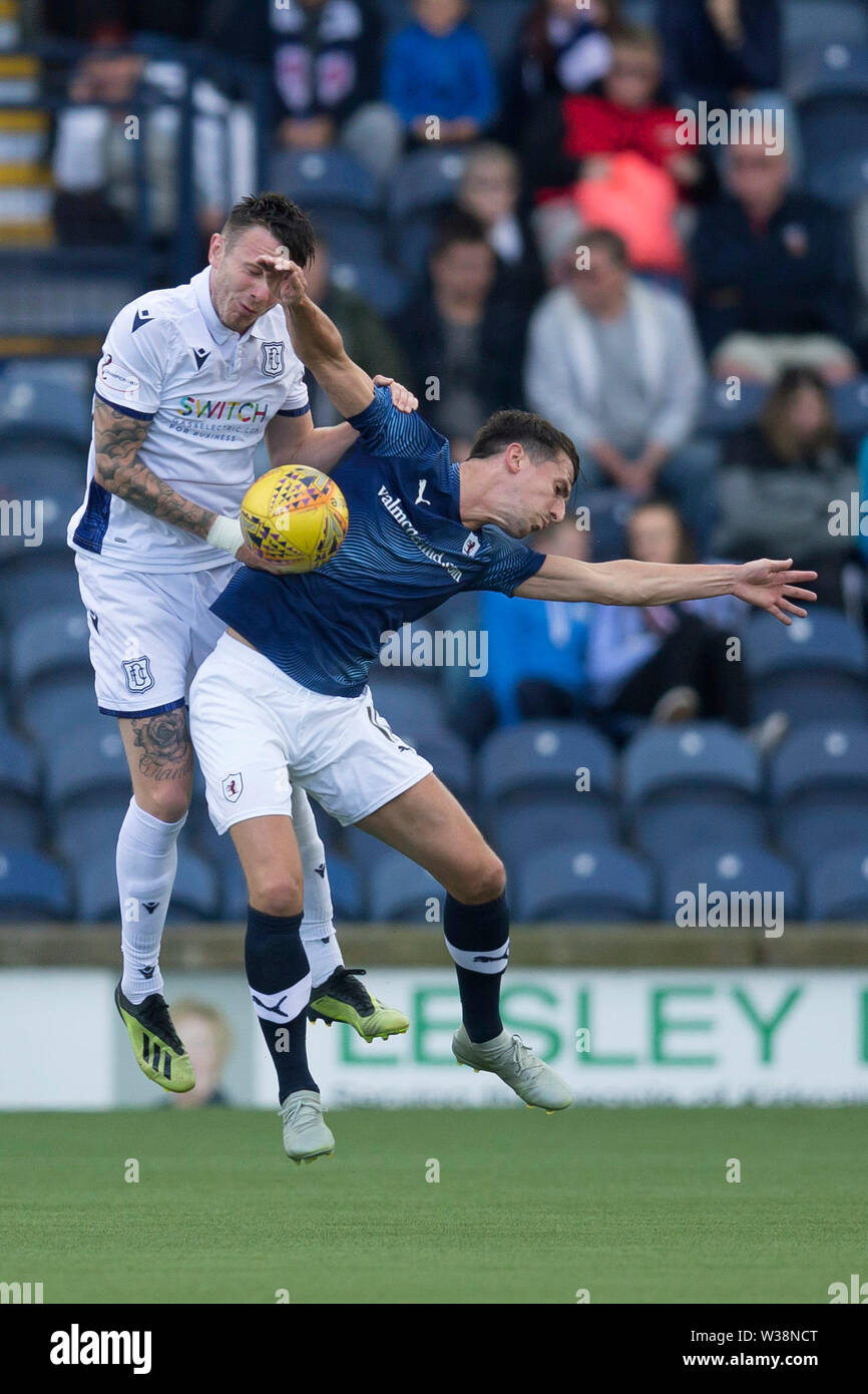 Starks Park, Kirkcaldy, UK. 13th July, 2019. Scottish League Cup football, Raith Rovers versus Dundee; Jordan McGhee of Dundee competes in the air with Grant Anderson of Raith Rovers Credit: Action Plus Sports/Alamy Live News Stock Photo