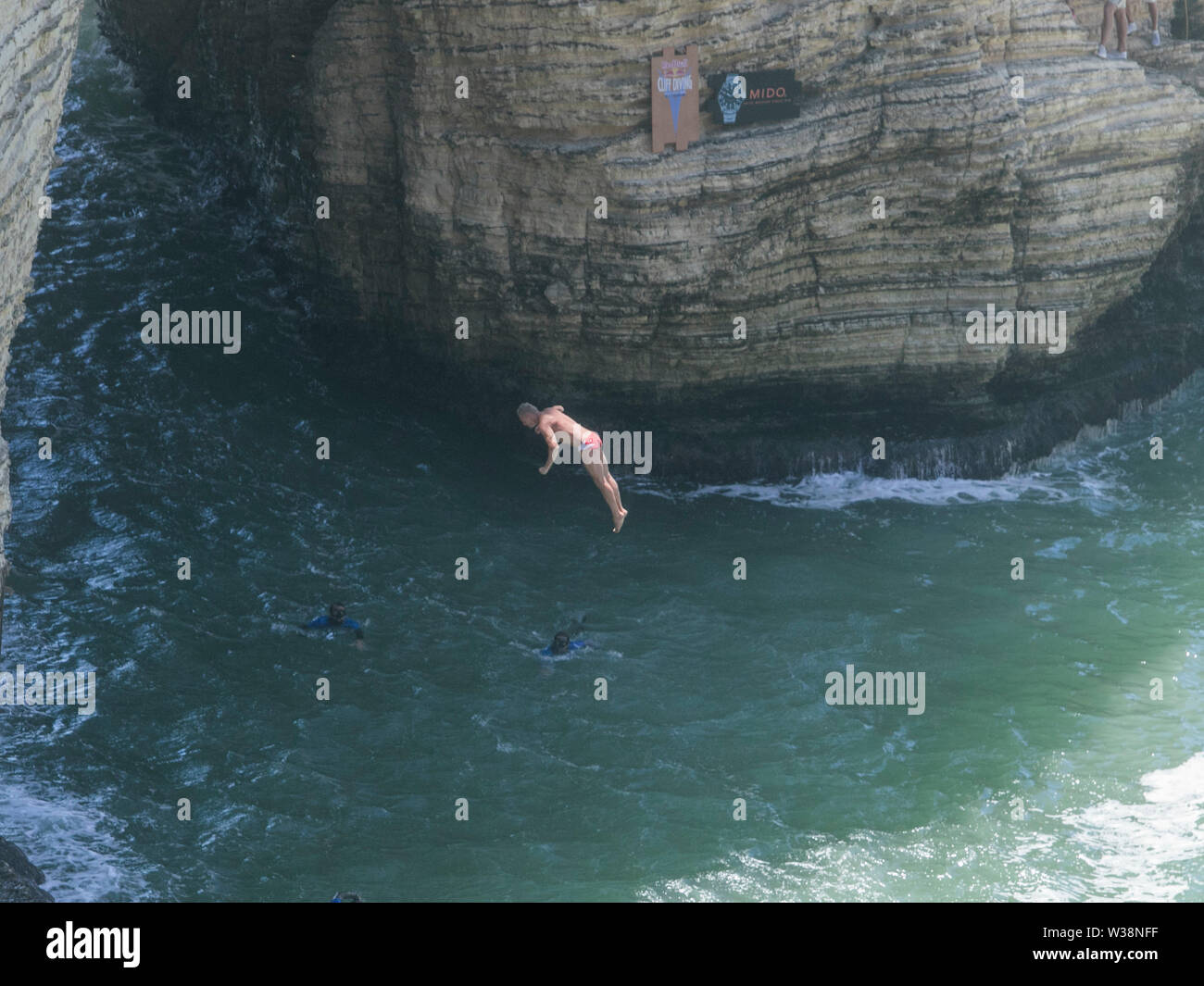 A diver contestant jumps into the waters of the Mediterranean Sea from