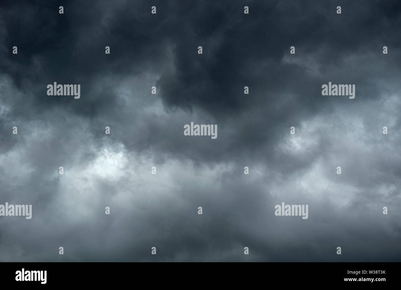 Dark and gloomy clouds signalling the impending arrival of a storm Stock Photo