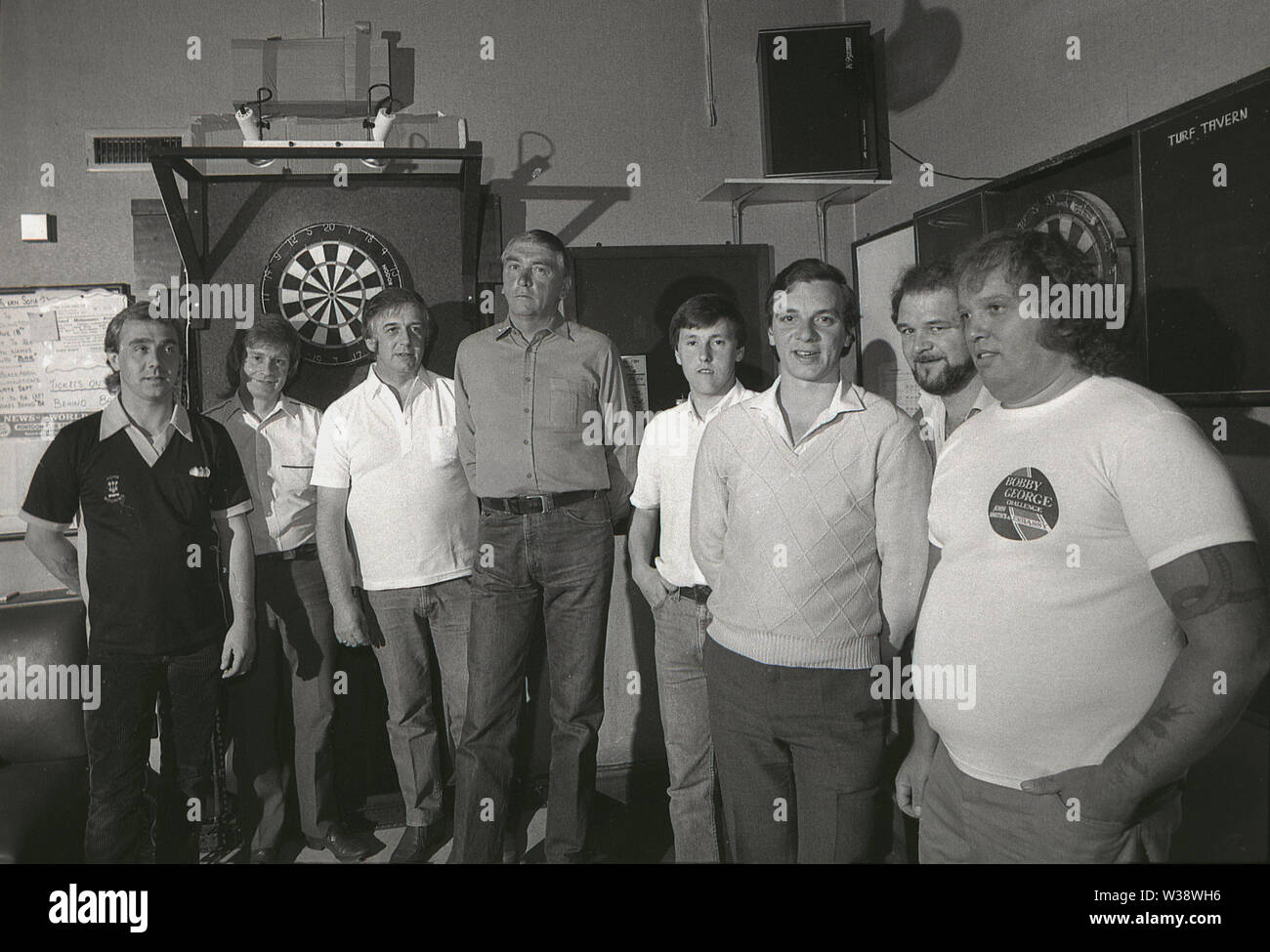 1980s, photo showing the inside of a pub with dart boards and a team of ...