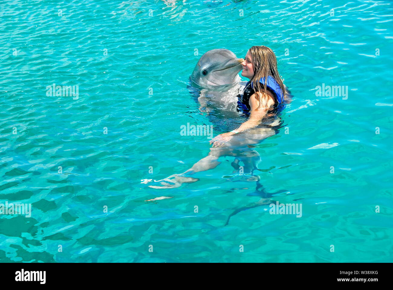 Swimming with the dolphins at Blue Lagoon Island near Nassau, Bahamas, a shore excursion from