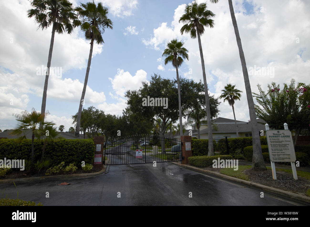 outside the entrance gates to a residential gated community in florida USA United States of America Stock Photo