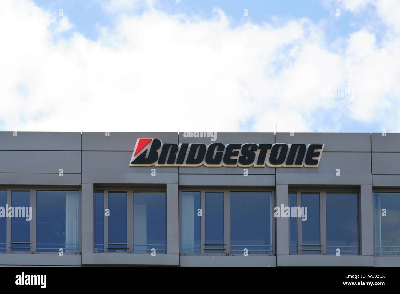 Bad Homburg, Germany - June 09, 2019: The logo of the tire manufacturer Bridgestone on the facade of a business building on 09 June 2019 in Bad Hombur Stock Photo