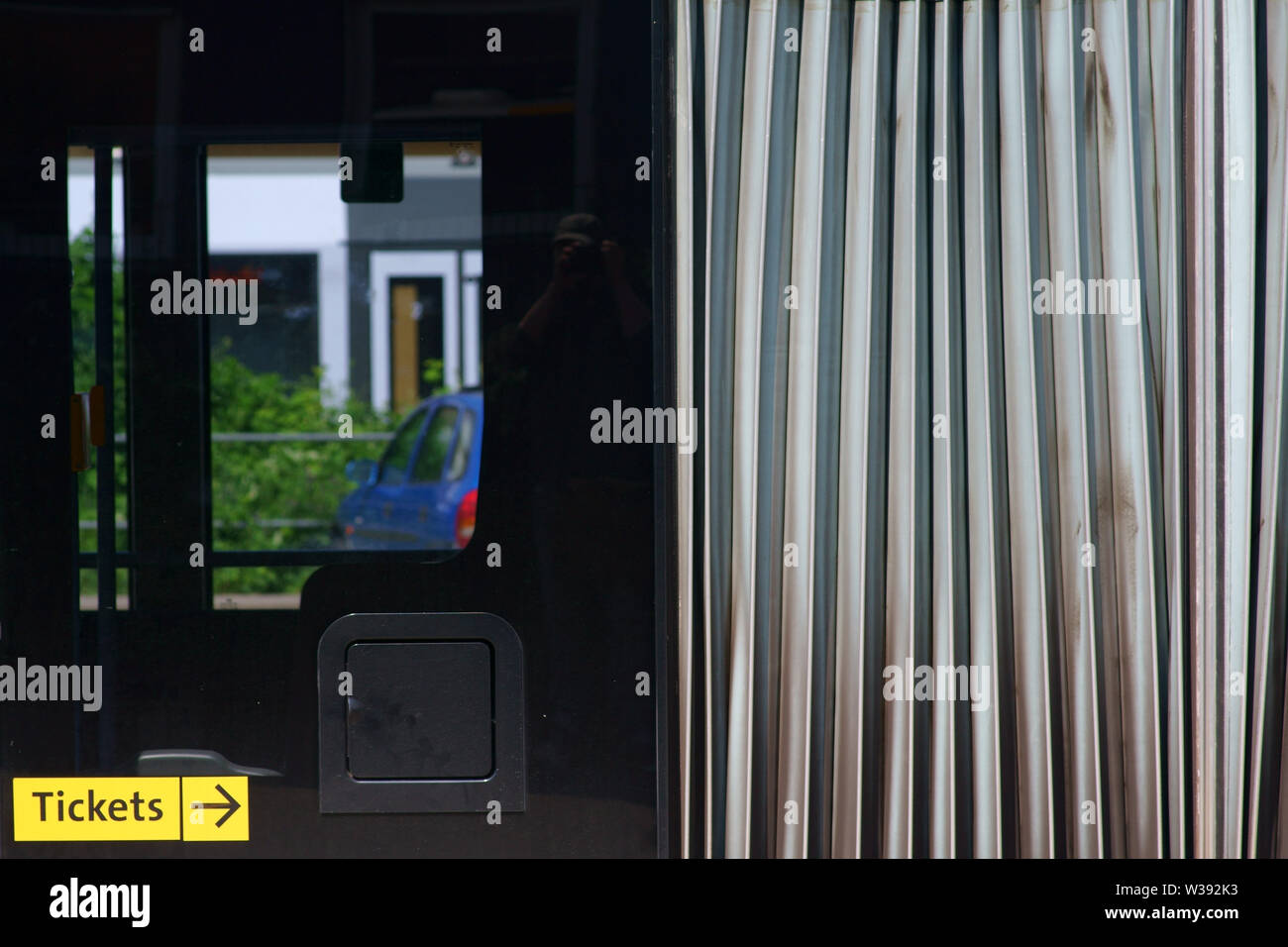 The closeup of the chassis of a articulated bus with a bellows as well