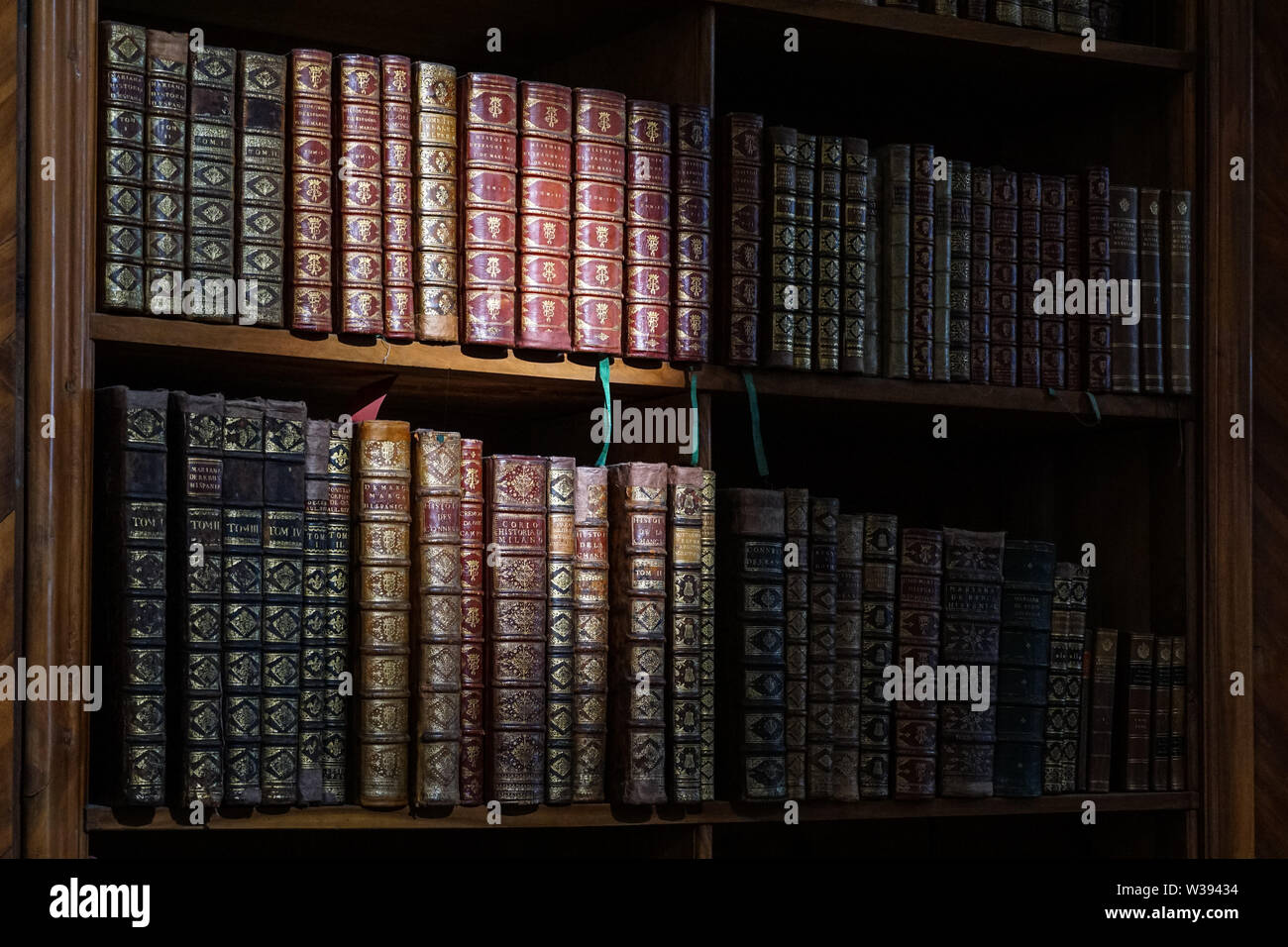 Old vintage books on shelf in library Stock Photo