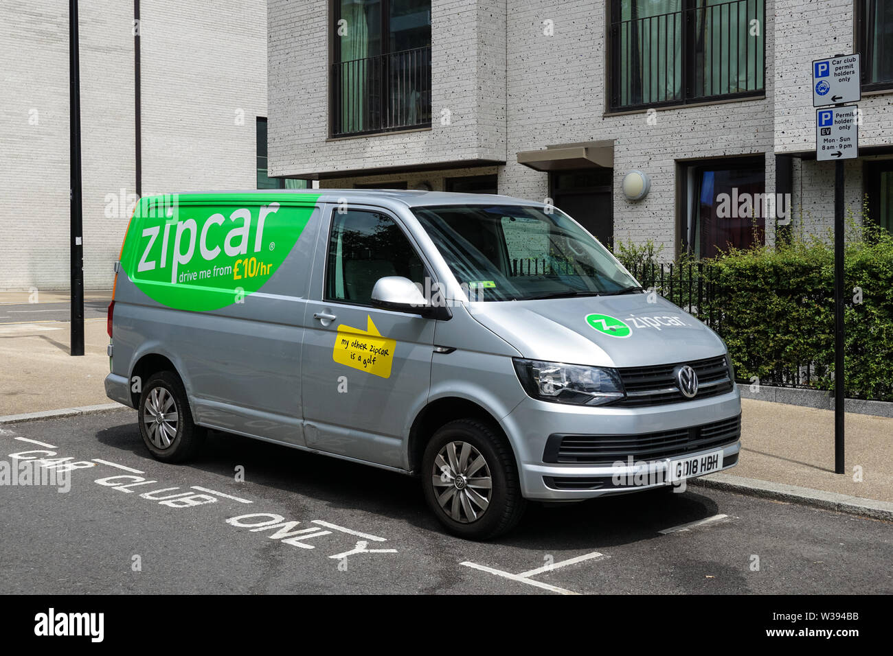 Zipcar van on residential street in London, England United Kingdom UK Stock Photo