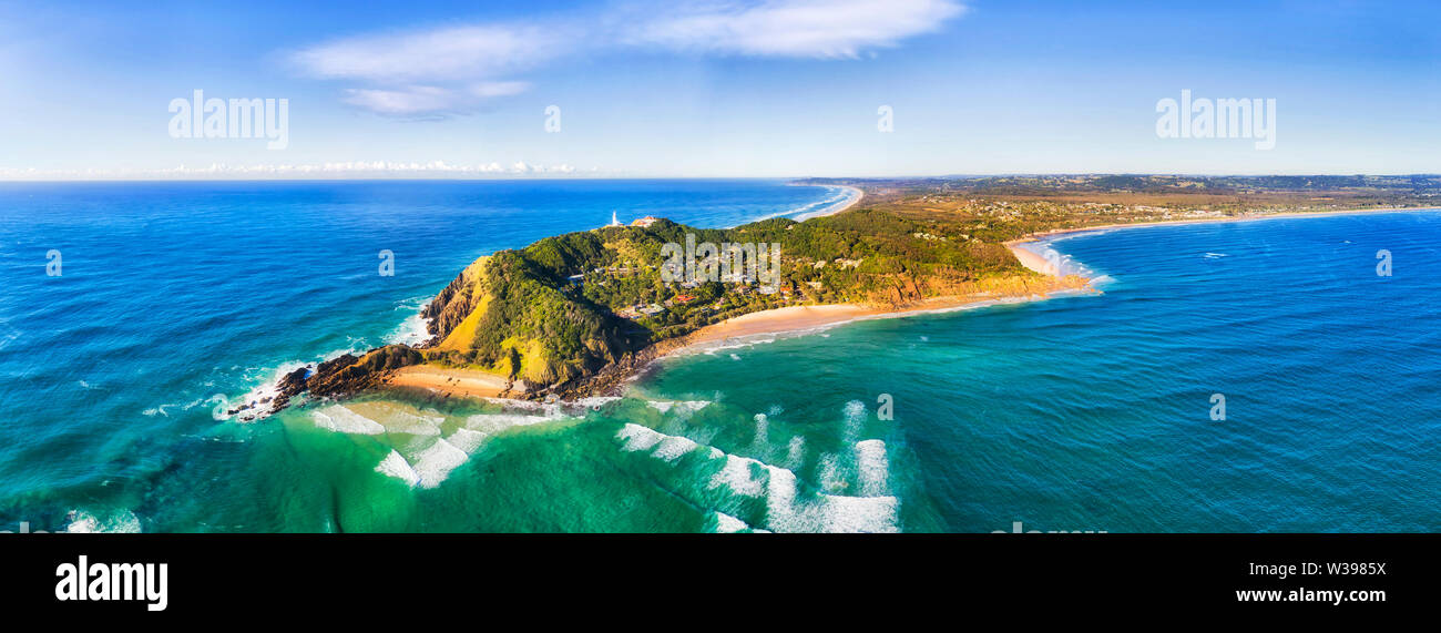Byron bay and famous lighthouse on the top of headland facing Pacific ocean - the most eastern part of Australian continent. Stock Photo