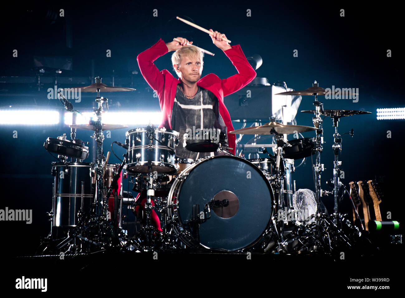 Dominic Howard, drummer of the the English band Muse, performing live ...