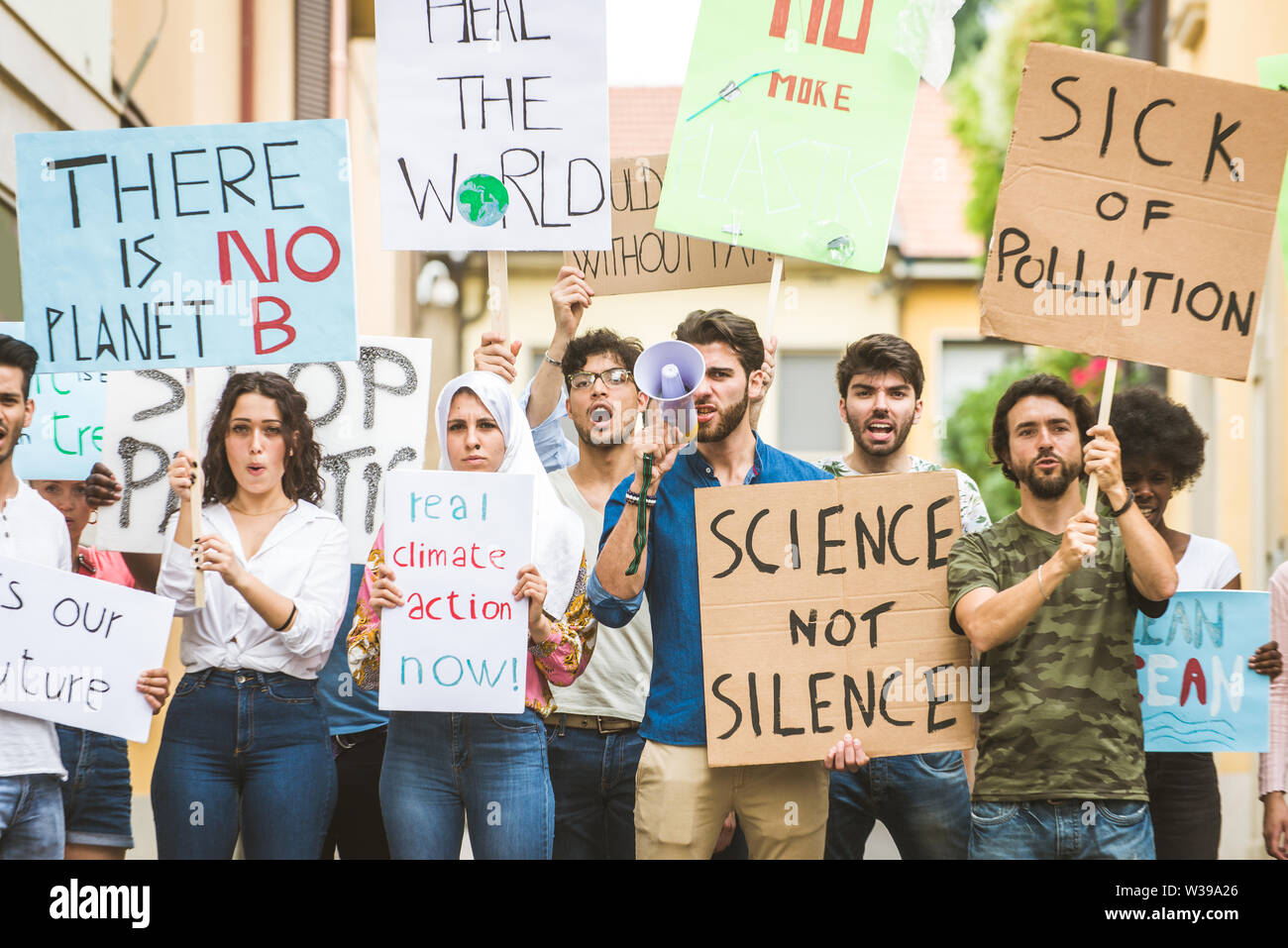 Group of activists is protesting outdoors - Crowd demonstrating against ...