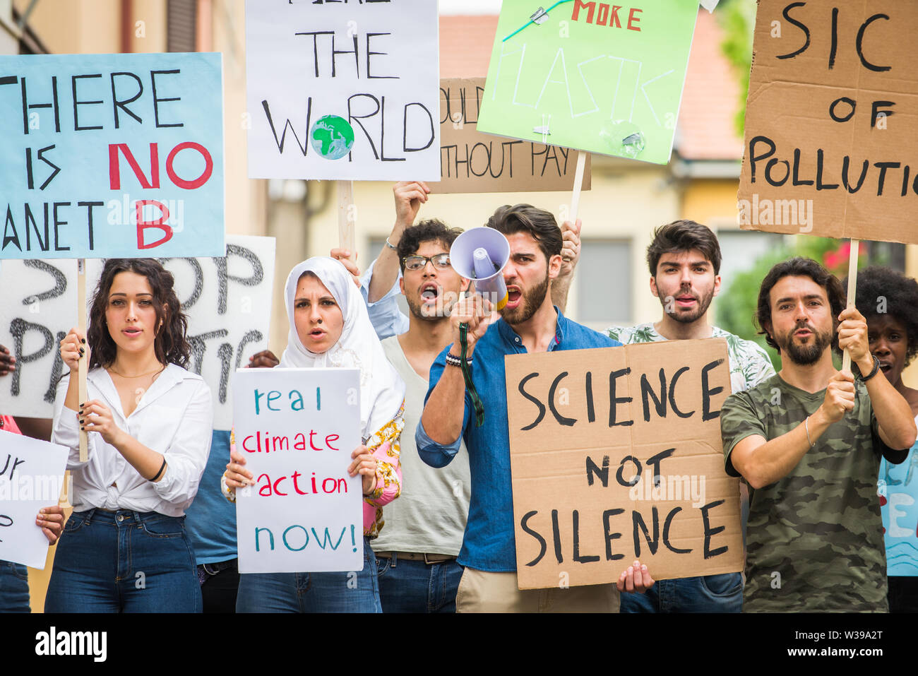 Group of activists is protesting outdoors - Crowd demonstrating against ...