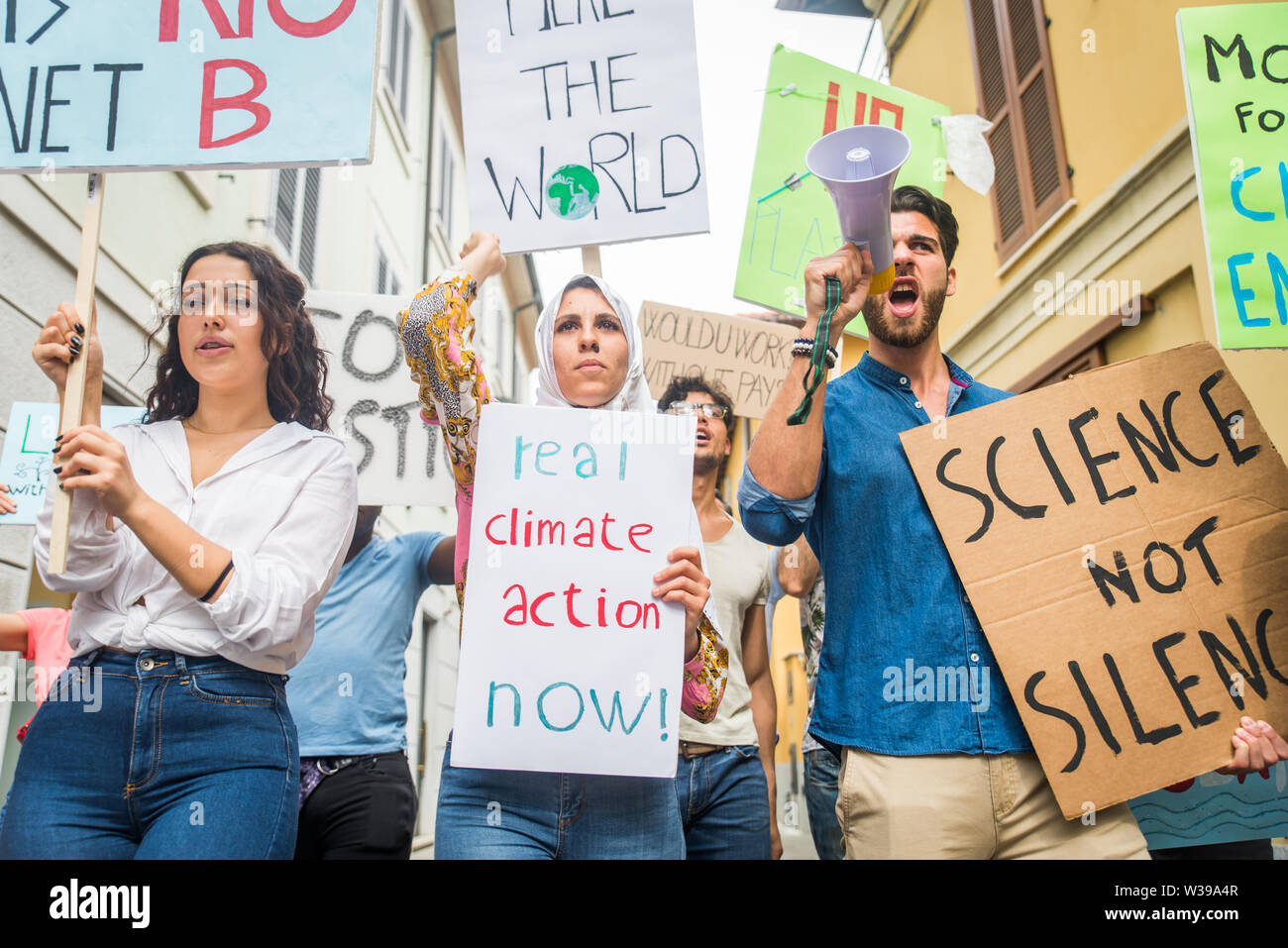 Group of activists is protesting outdoors - Crowd demonstrating against ...