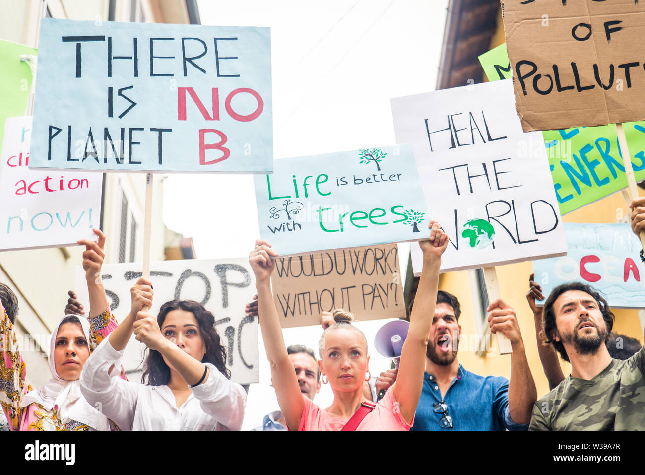 Group of activists is protesting outdoors - Crowd demonstrating against ...