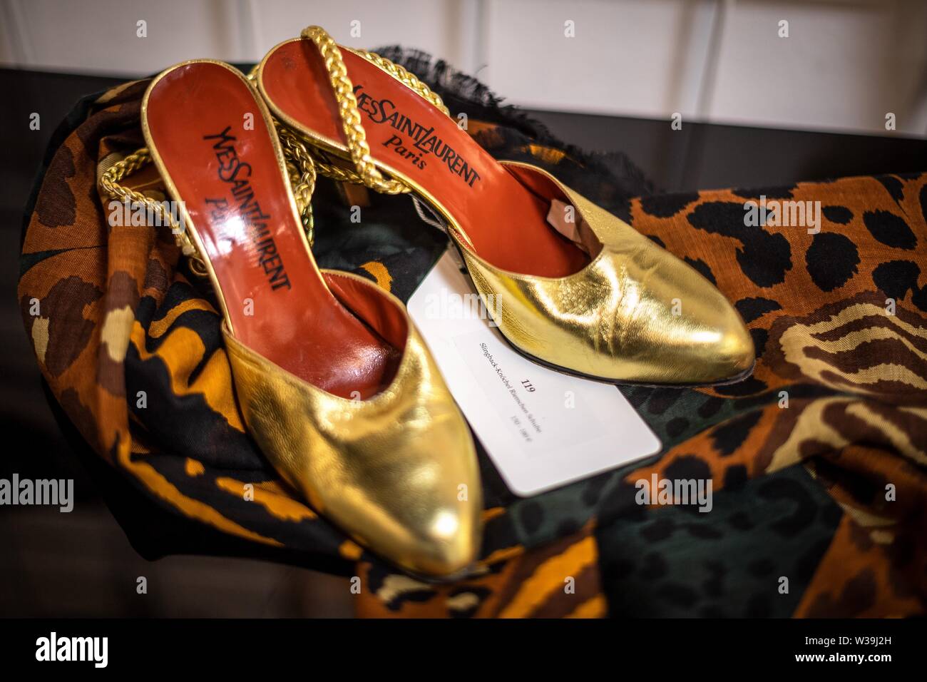 Munich, Germany. 11th July, 2019. Shoes by Yves Saint Laurent from the 1990s are presented at the Neumeister auction house. Vintage fashion is the order of the day. For many it is a real sport to find such precious parts. In Munich on Monday at the auction house Neumeister in the context of the auction 'Vintage Culture' designer pieces come under the hammer. (to dpa 'That's what!' - Of vintage fashion and grandma's favorite pieces.') Credit: Sina Schuldt/dpa/Alamy Live News Stock Photo