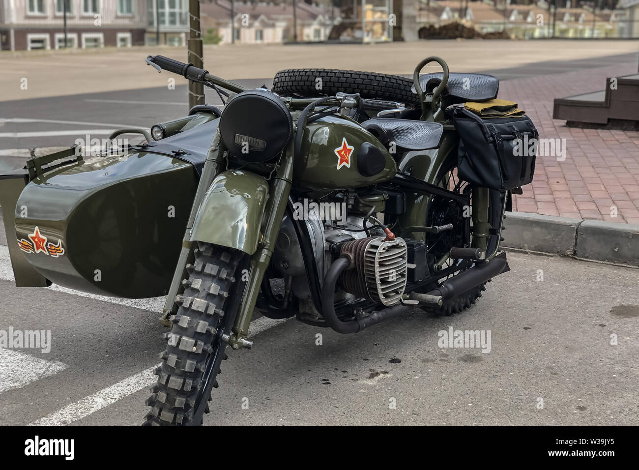 Russian retro motorcycle URAL khaki. Moto during the second world war with  Soviet symbols Stock Photo - Alamy
