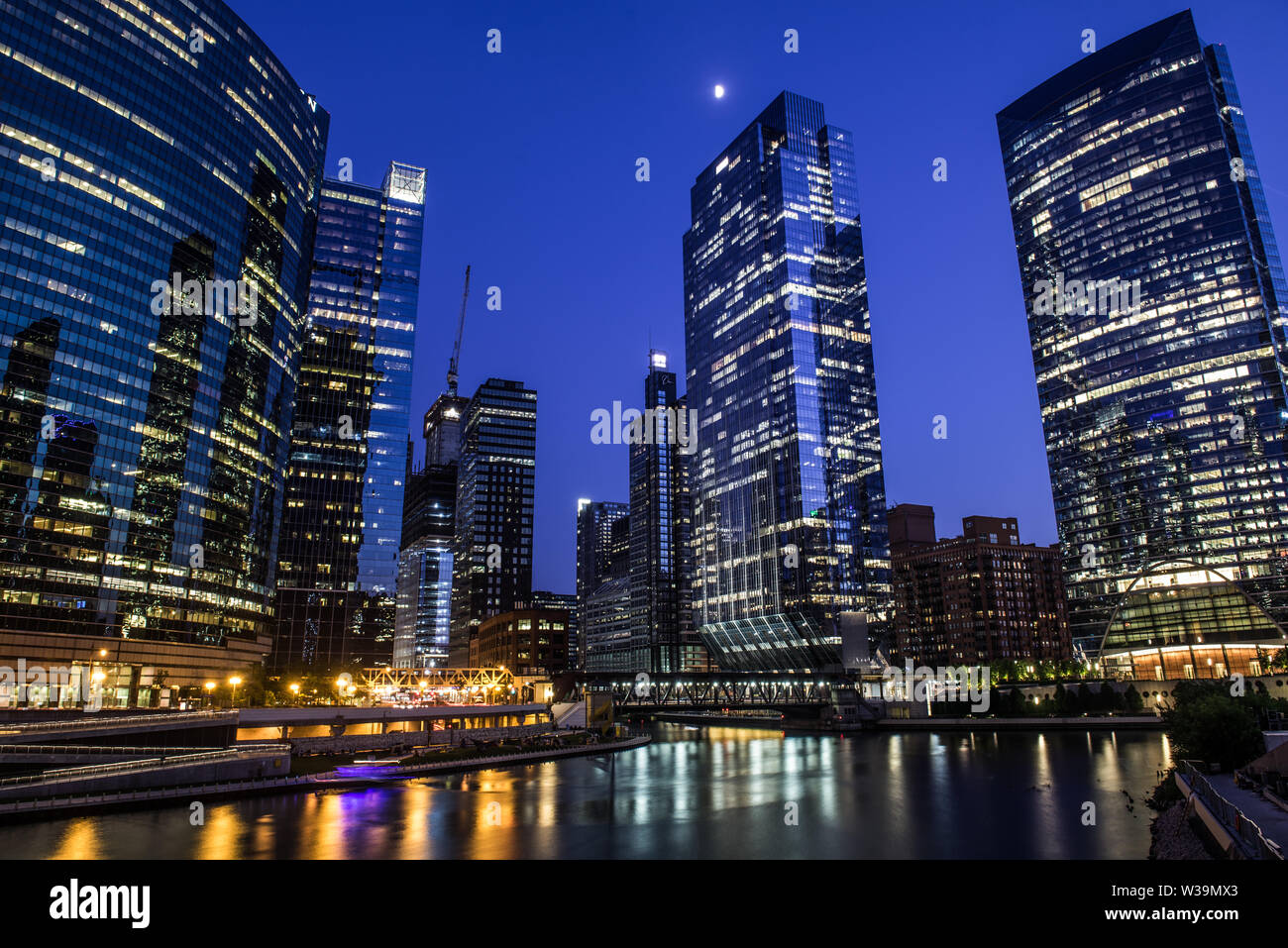 view of sky scrapers,  river and west lake street bridge from Franklin–Orleans Street Bridge at blue hour Stock Photo