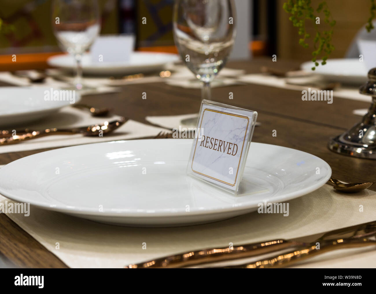 Reservation on a dinner table at the restaurant, plate reserve Stock