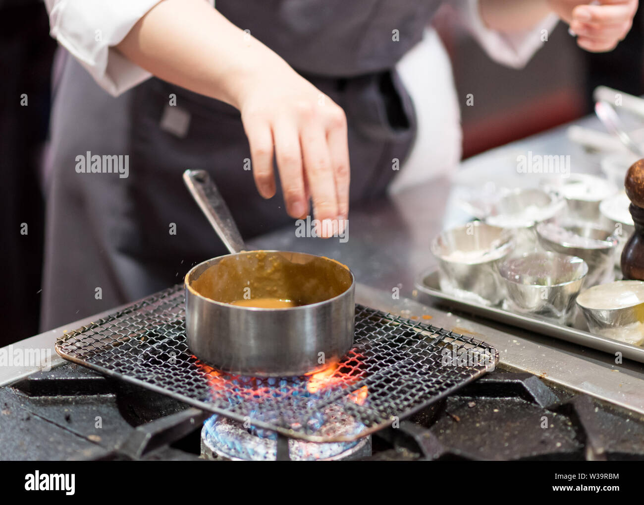 Chef preparing recipe soup hi-res stock photography and images - Alamy