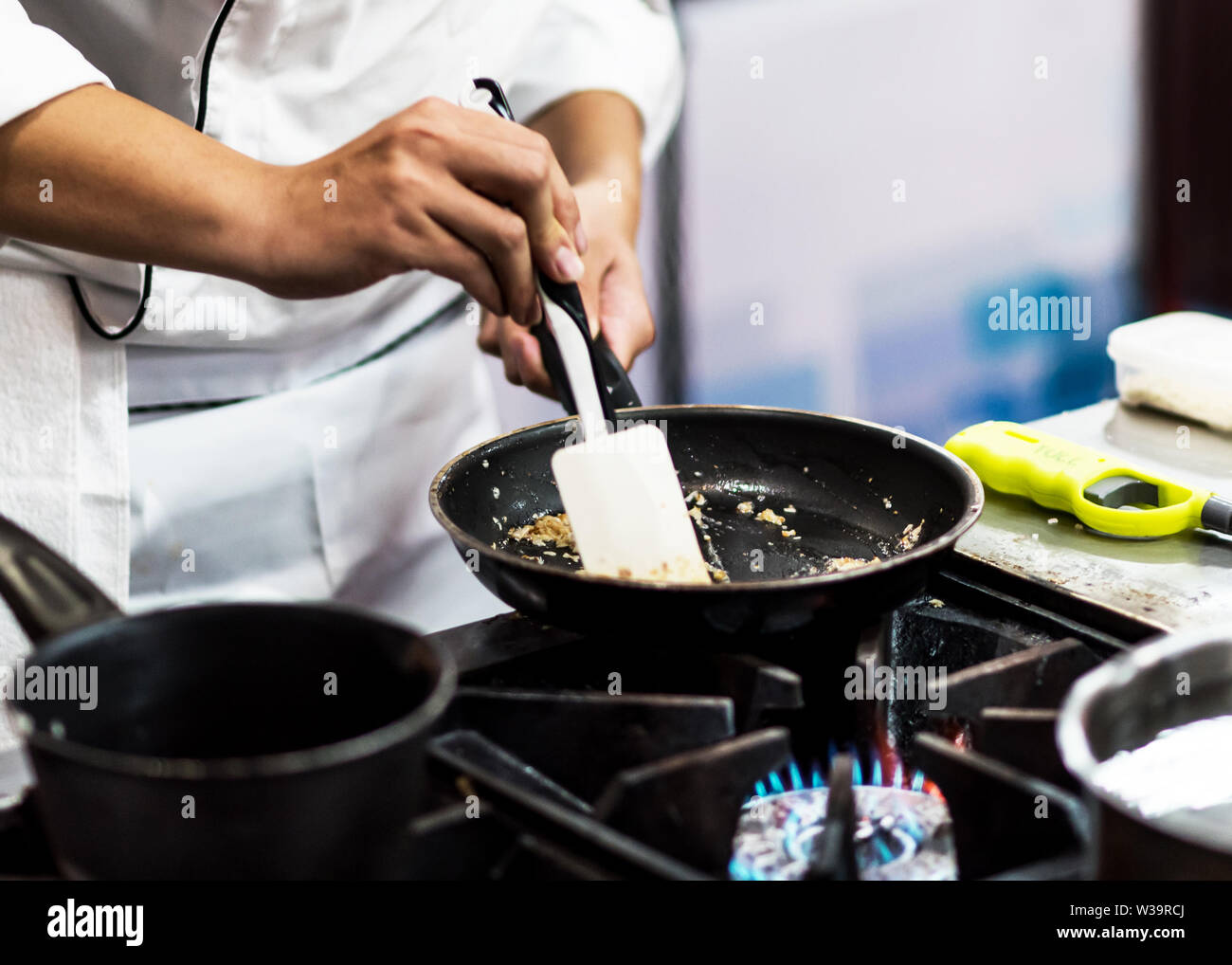 Chef cooking food in the kitchen, Chef preparing food Stock Photo - Alamy