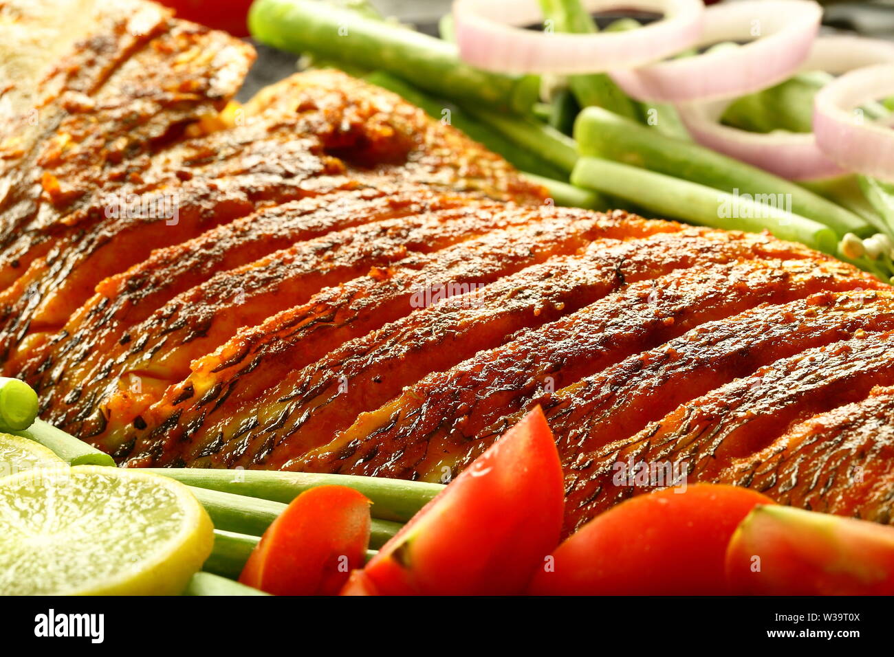 Spicy fried fresh fish seafood background Stock Photo Alamy