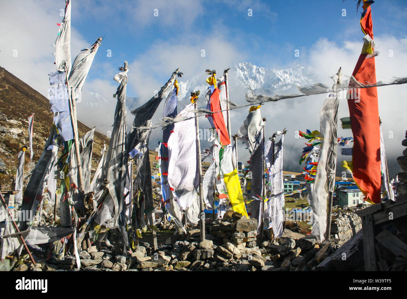 Prayers flags and stupa in Langtang Valley, Nepal. The memorial of people died due to the devastation of earthquake 2015. Stock Photo