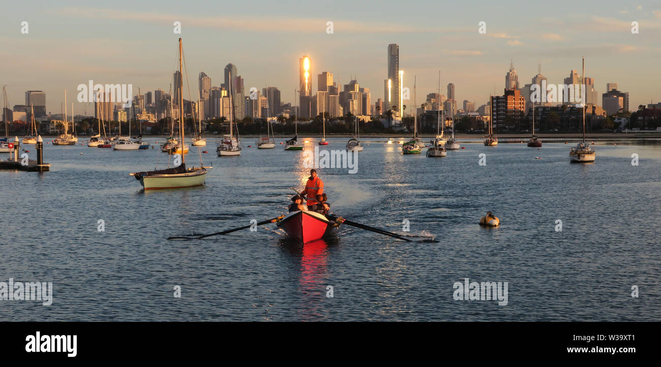 Surf boat and the city. The skyline of Melbourne with a surf boat in