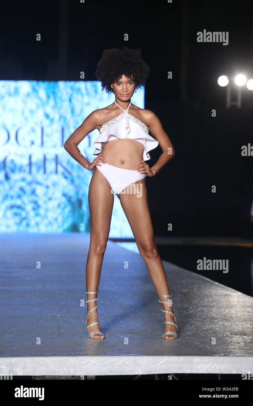 Miami, USA. 13th July, 2019. A model walks the runway during Badgley  Mischka Swimwear 2020 Collection Runway Show - Front Row - Paraiso Miami  Beach at The W Hotel South Beach on