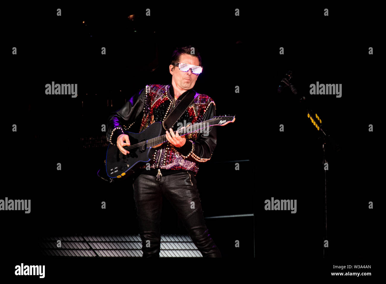 Milan, Italy. 13th July, 2019. Mattew Bellamy, singer and guitarist of the the English band Muse, performing live on stage for in Milan, at the San Siro Stadium for the “Simulation Theory” tour 2109 Credit: Alessandro Bosio/Pacific Press/Alamy Live News Stock Photo