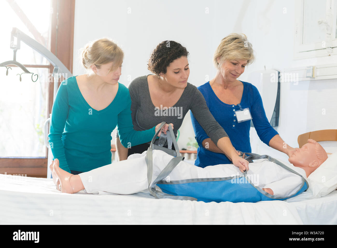 learning to use a hoist Stock Photo Alamy