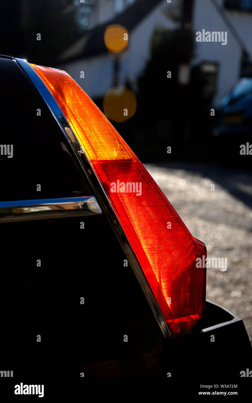 Sunlight shining through the rear turn and stop lights on an MGB-GT sports car Stock Photo