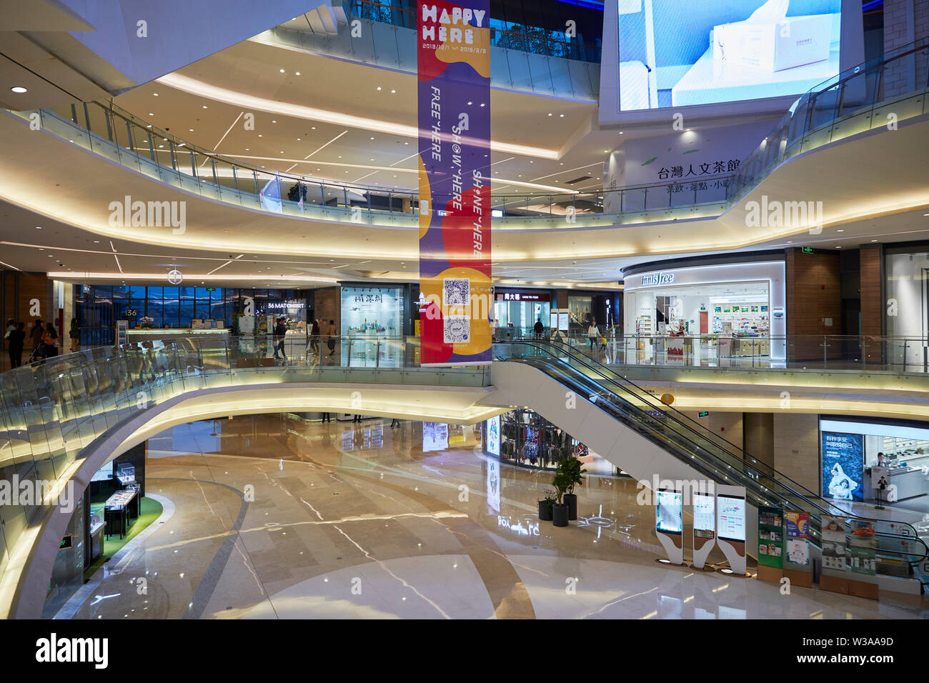 Interior of the O'Plaza shopping mall at OCT Harbour. Shenzhen, Guangdong Province, China. Stock Photo