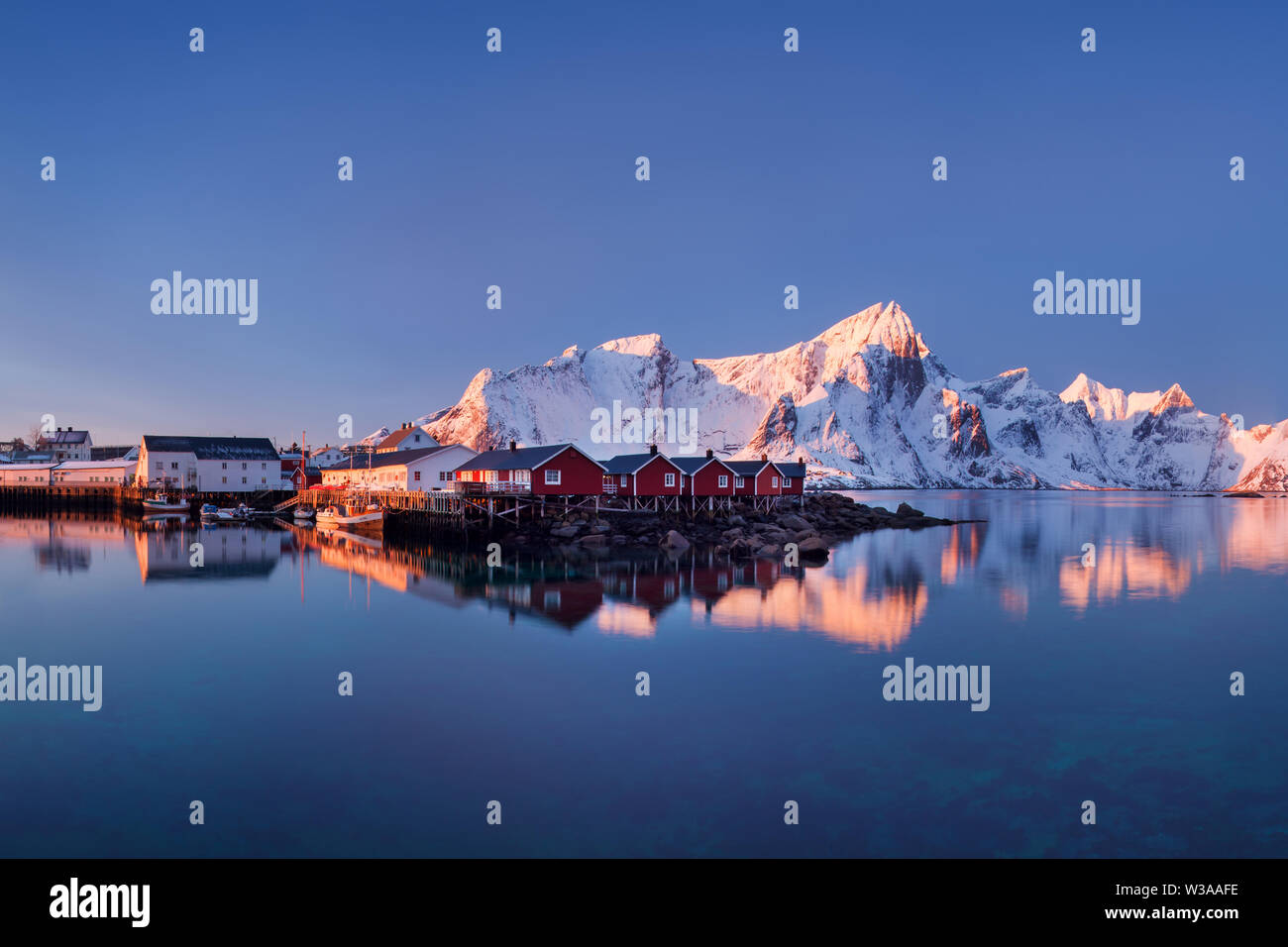 Scenic fjord on Lofoten islands, Reine, Norway. First snow in mountains. Specific landscape wint fjords and rocks. Arctic circle. Landscape with sea Stock Photo